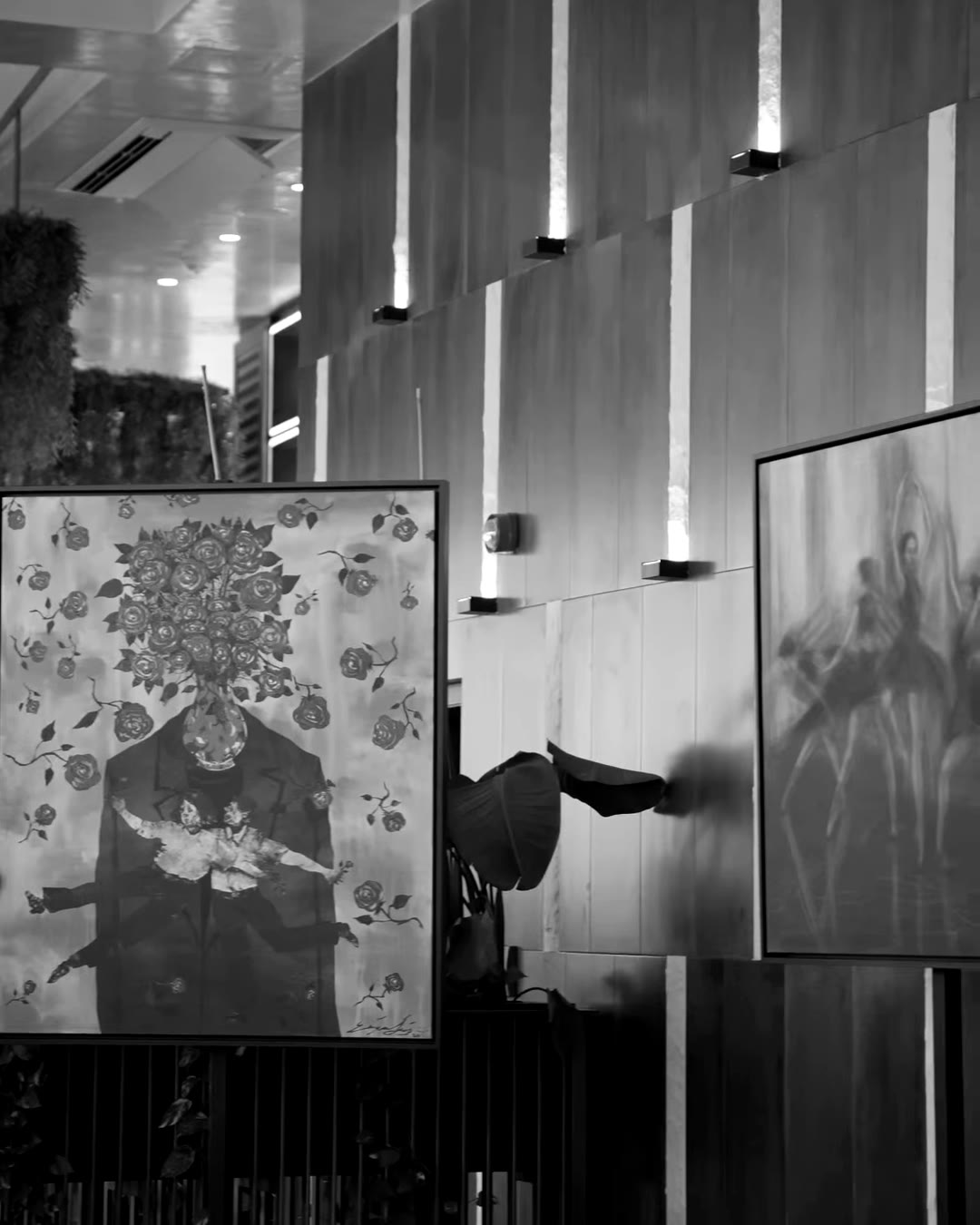Residency paintings hung along a dark timber corridor at the launch evening.